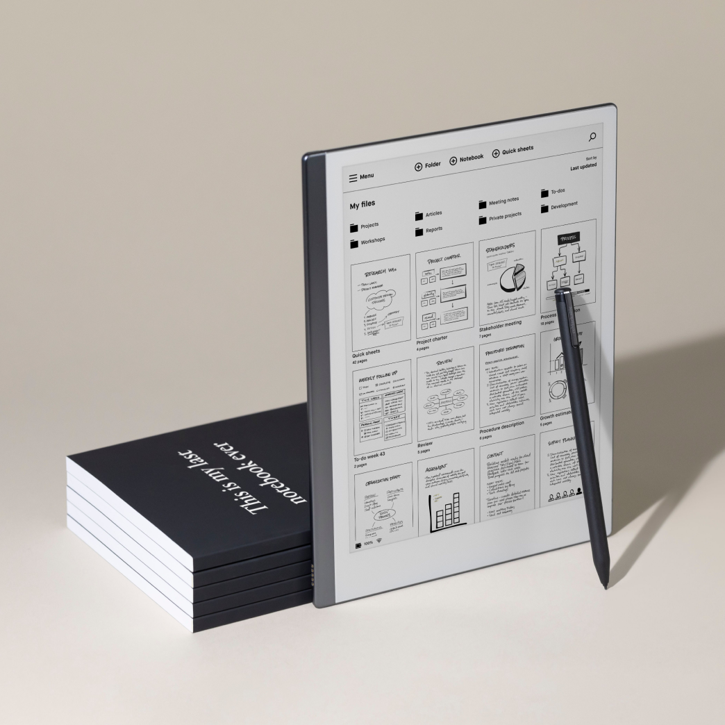 Remarkable device beside a stack of boxed Remarkable devices.