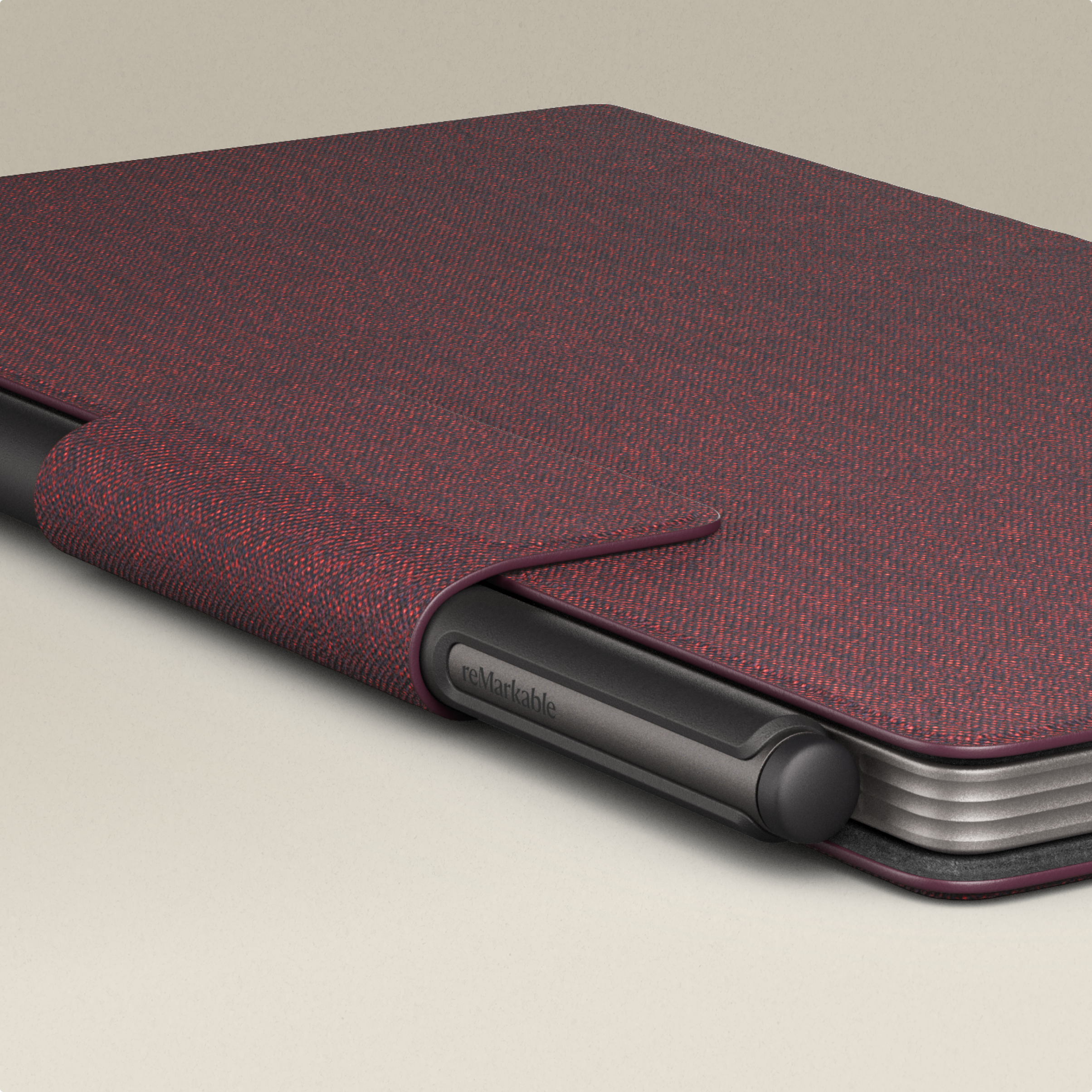 reMarkable Paper Pro Move tablet with a Marker attached, in a burgundy color Book Folio cover.
