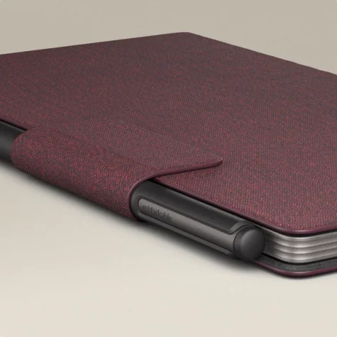 reMarkable Paper Pro Move tablet with a Marker attached, in a burgundy color Book Folio cover.