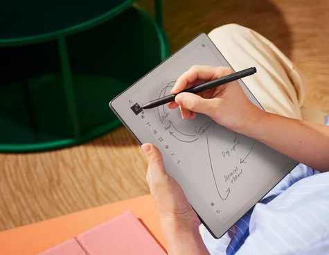 A close up photo of someone sketching on a reMarkable paper tablet, with Marker Plus