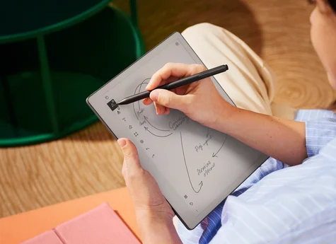 A close up photo of someone sketching on a reMarkable paper tablet, with Marker Plus