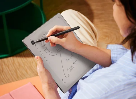 A close up photo of someone sketching on a reMarkable paper tablet, with Marker Plus
