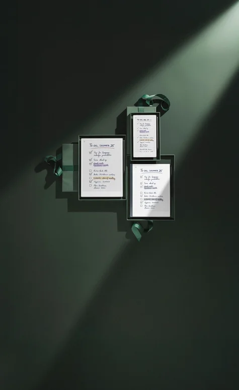 reMarkable Paper Pro, reMarkable Paper Pro Move and reMarkable 2 all gift wrapped in dark green paper, displaying TO DO lists for December 25th .