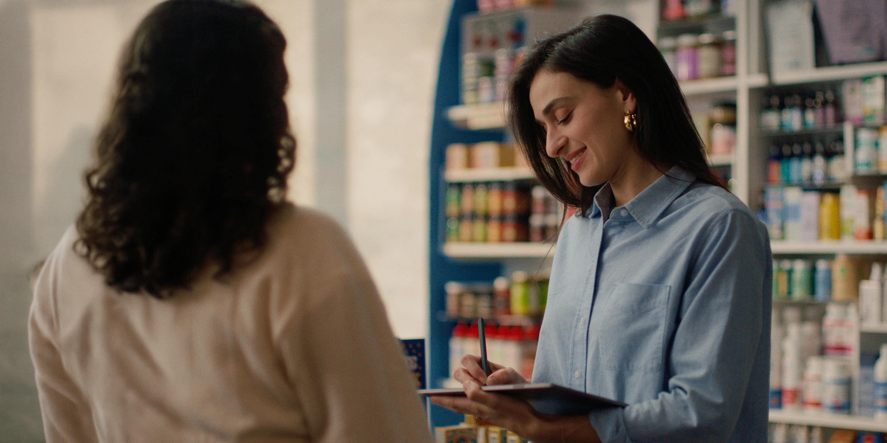 A manager holding her reMarkable Paper Pro tablet.