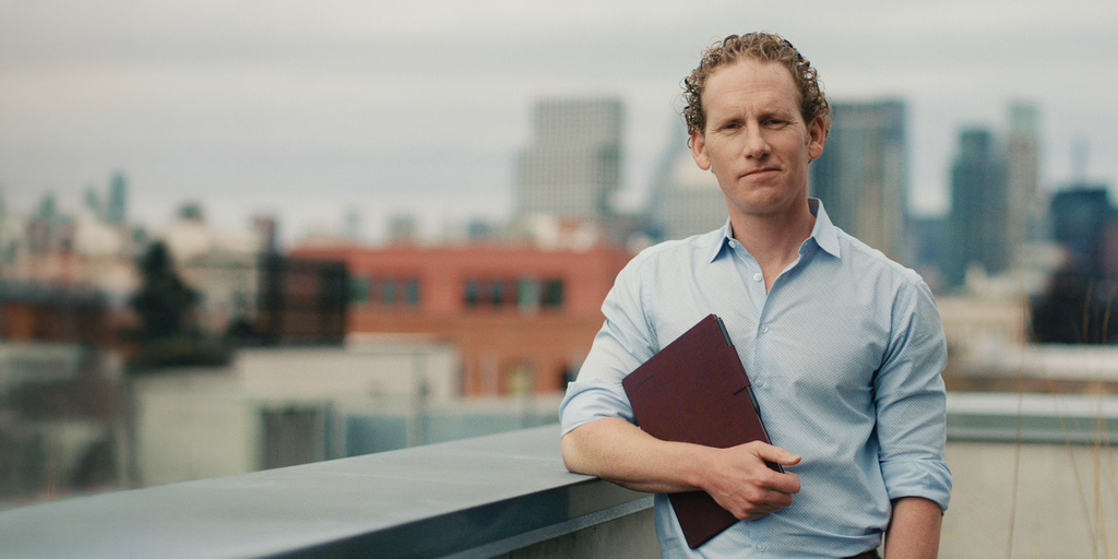 An academic holding his reMarkable Paper Pro tablet.