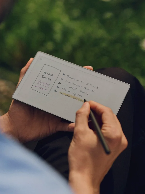 A person writing notes with the Marker on a reMarkable Paper Pro tablet.