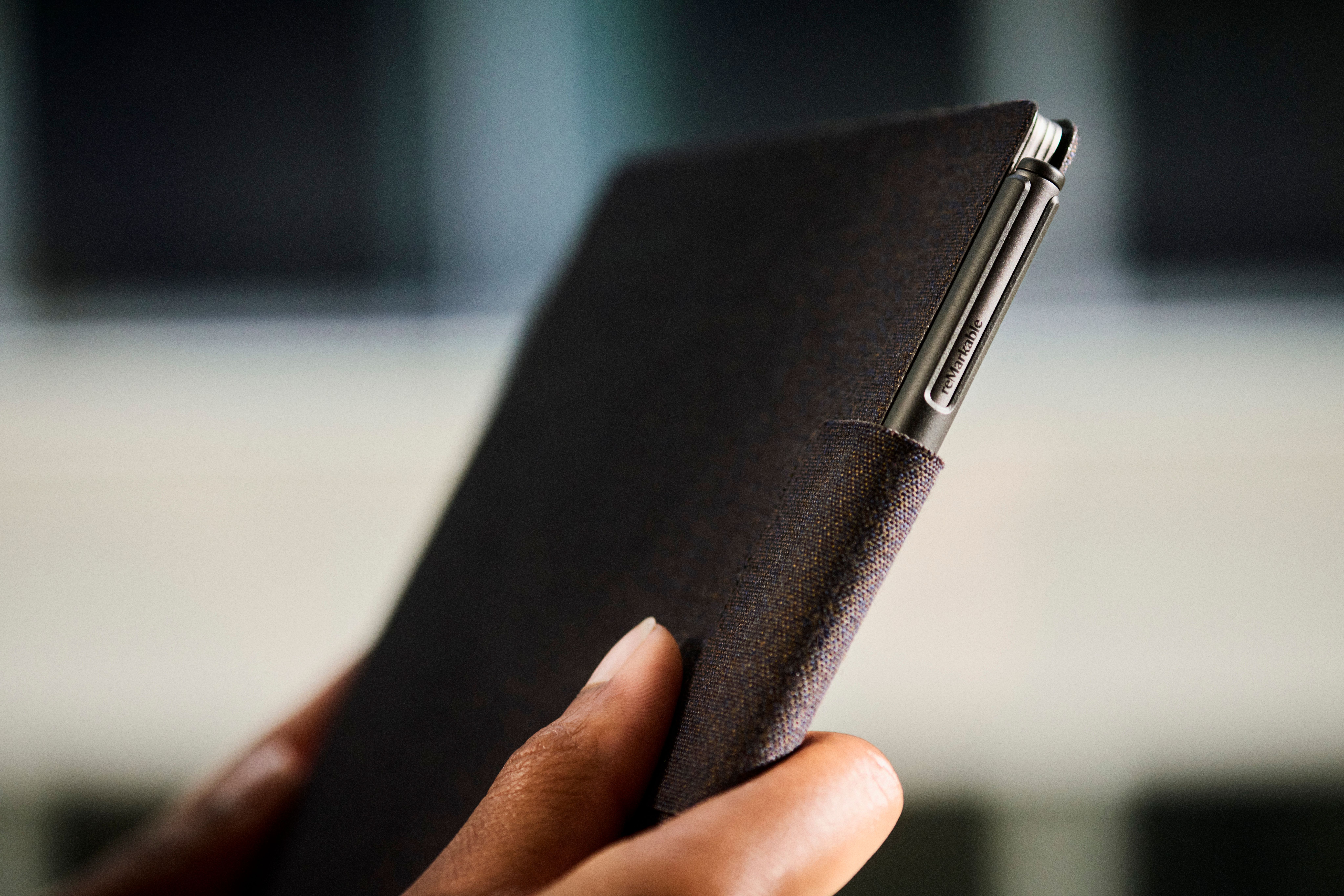 Close up of a reMarkable Paper Pro with a Type Folio folded and closed around it.
