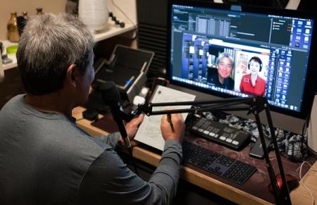 Guy Kawasaki in front of a computer recording his podcast
