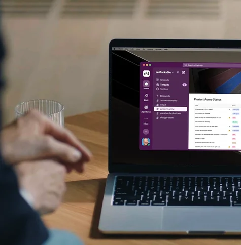 A laptop with a Slack workspace full of ideas
