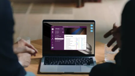 Two persons watching the Slack app on a desktop.