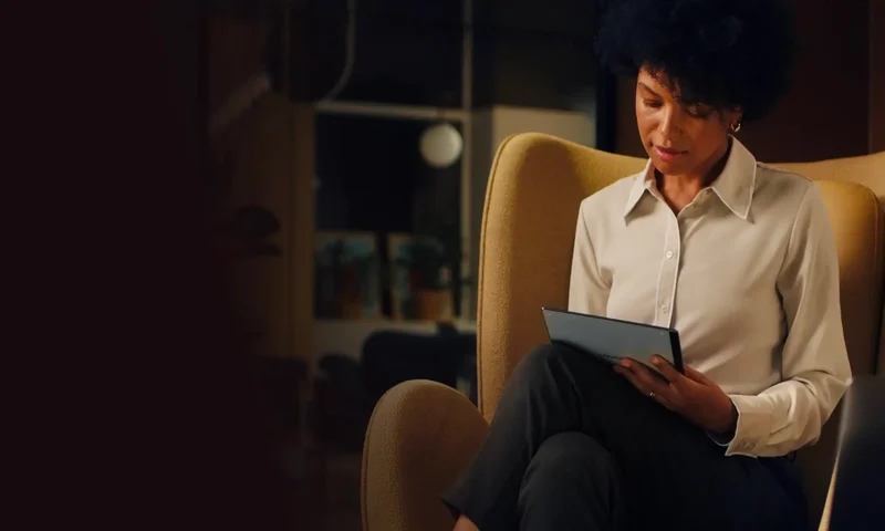 Woman in chair with reMarkable tablet