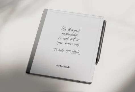reMarkable 2 tablet with handwritten notes and the Marker magnetically attached.