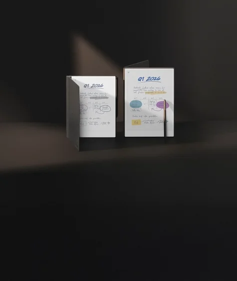 reMarkable 2 and reMarkable Paper Pro arranged on a geometric black structure, with Book Folios in brown premium leather and Cobalt mosaic weave and associated Marker Plus’.