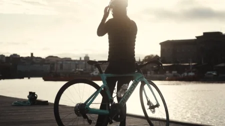 Filippa next to a bicycle on a dock.