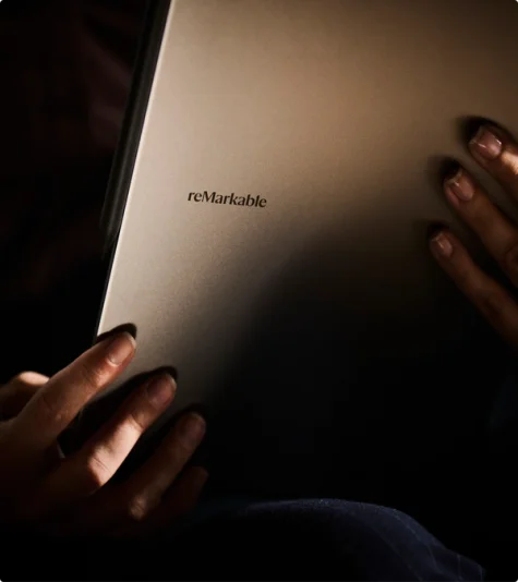 A detailed close-up of the back of the reMarkable Paper Pro. The focus is on the smooth, matte finish of the anodized aluminum chassis and the minimalist reMarkable logo engraved on the surface.
