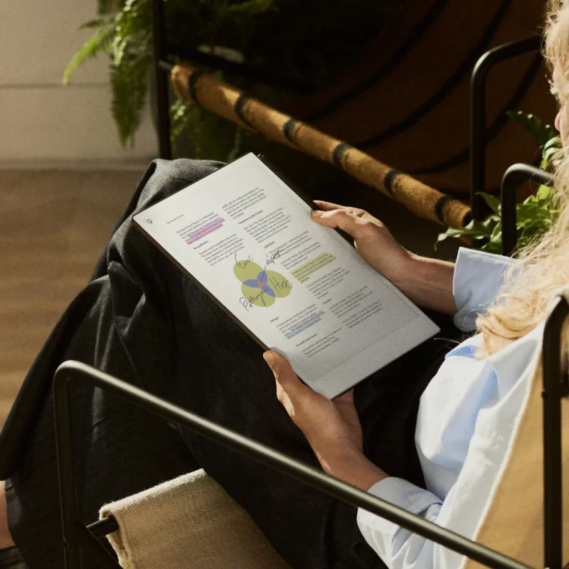 Person sitting with device