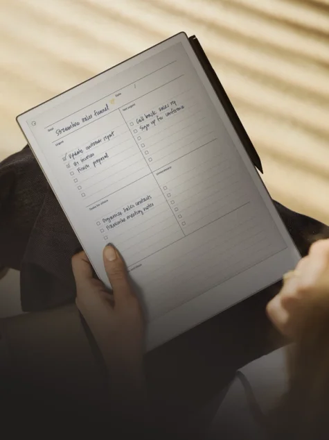Remarkable paper tablet in persons hands.