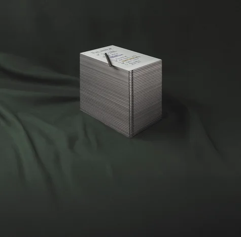 A stack of reMarkable Paper tablets, with a reMarkable Paper Pro with a to-do list on the top.