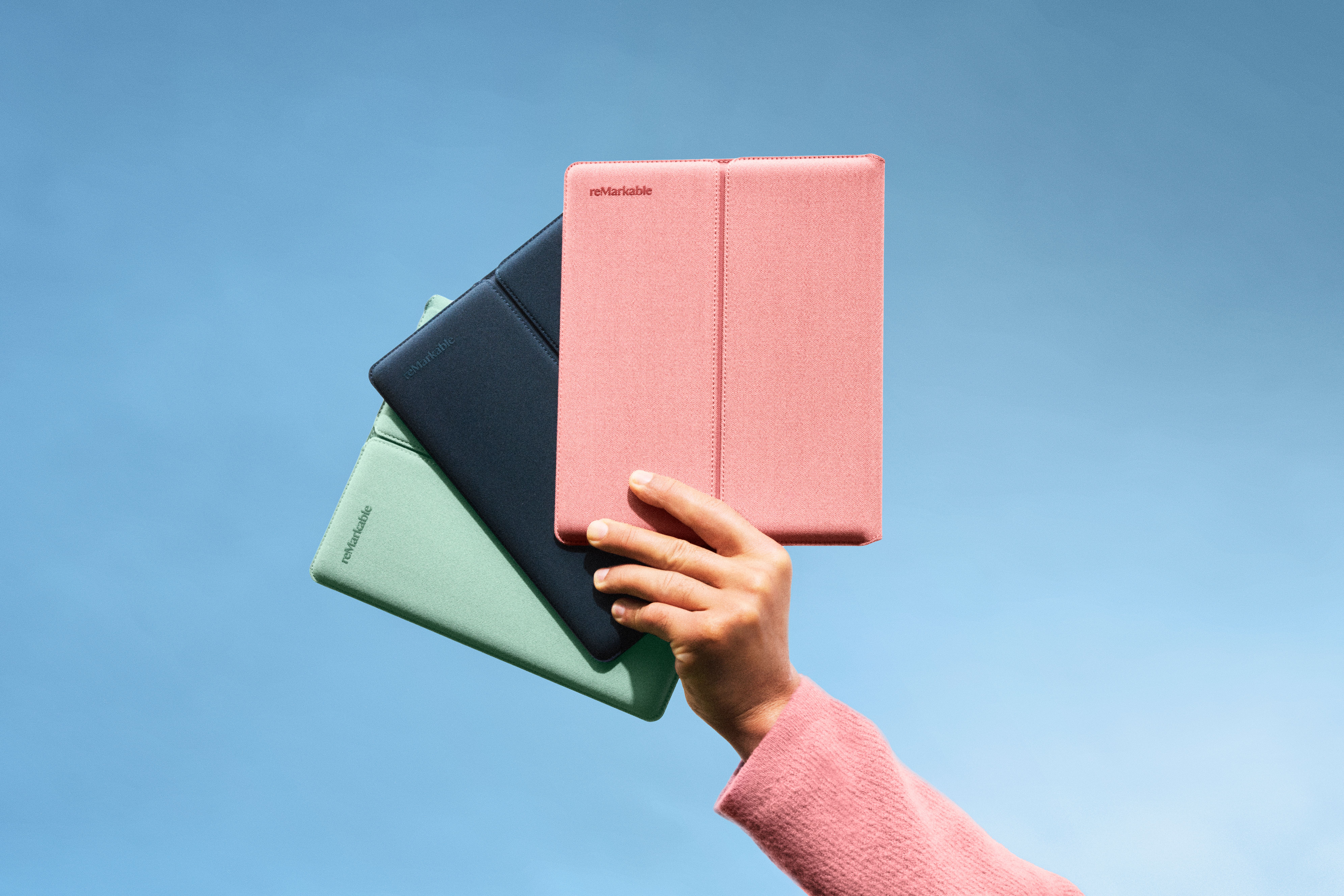 The selection of Sleeve Folio colors, Ocean Blue, Mist Green, and Desert Pink.