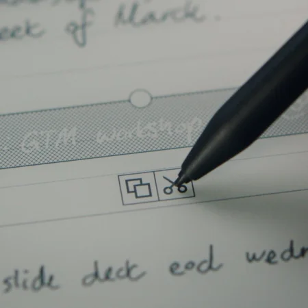 A reMarkable paper tablet showing a cut option being selected with the Marker.