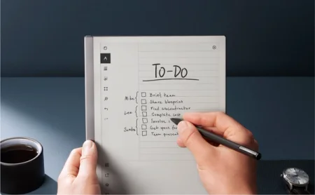 reMarkable 2 paper tablet displaying a To-Do list, hand writing a note with the Marker.