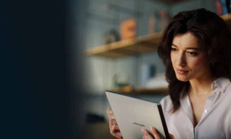 Woman writing on reMarkable tablet