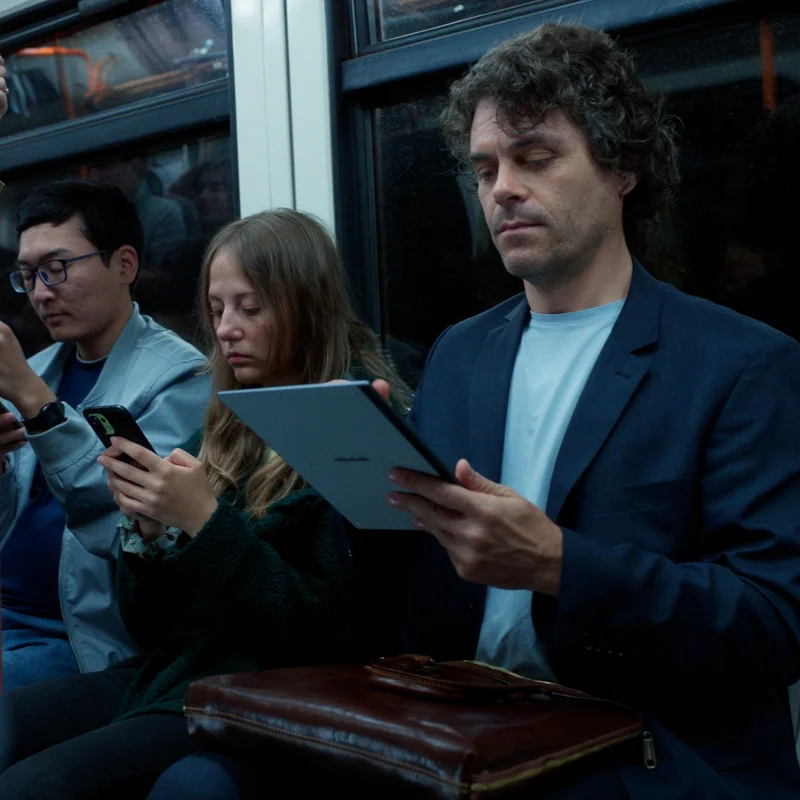 Man working on reMarkable 2 on the train