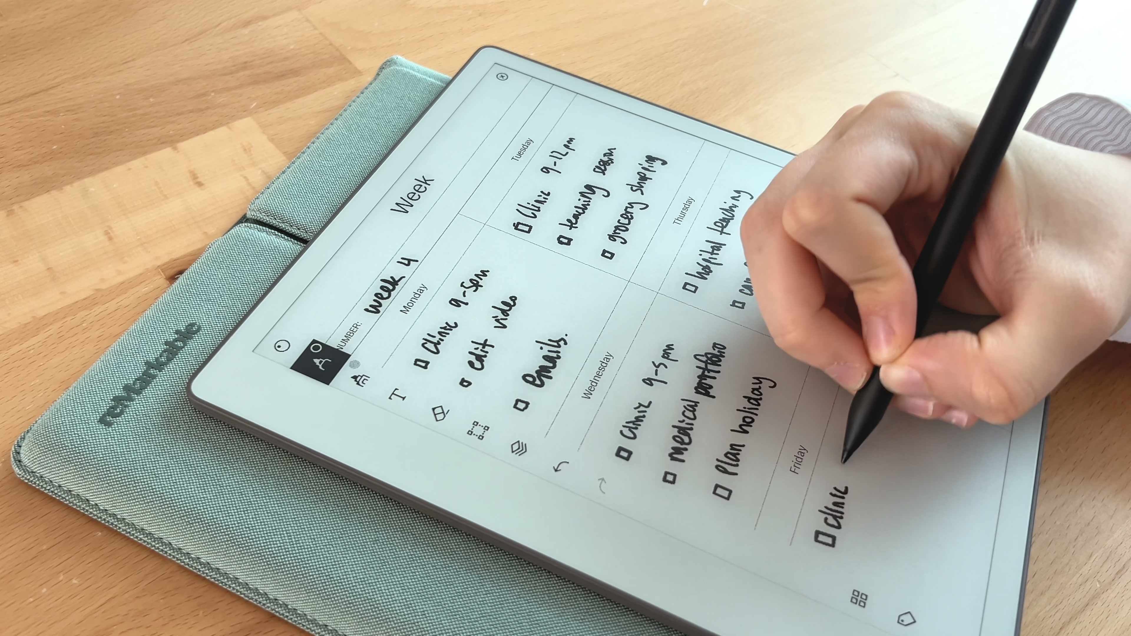 Hazal taking notes in her weekly planner on a reMarkable Paper Pure tablet.