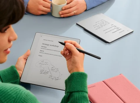 A man and a woman in discussion over notes on a reMarkable Paper Pure