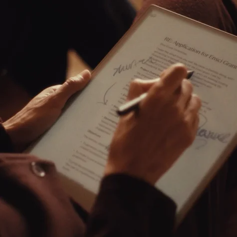 A reMarkable Paper Pro showing annotation on a PDF in dim light with the adjustable light on the tablet turned on.