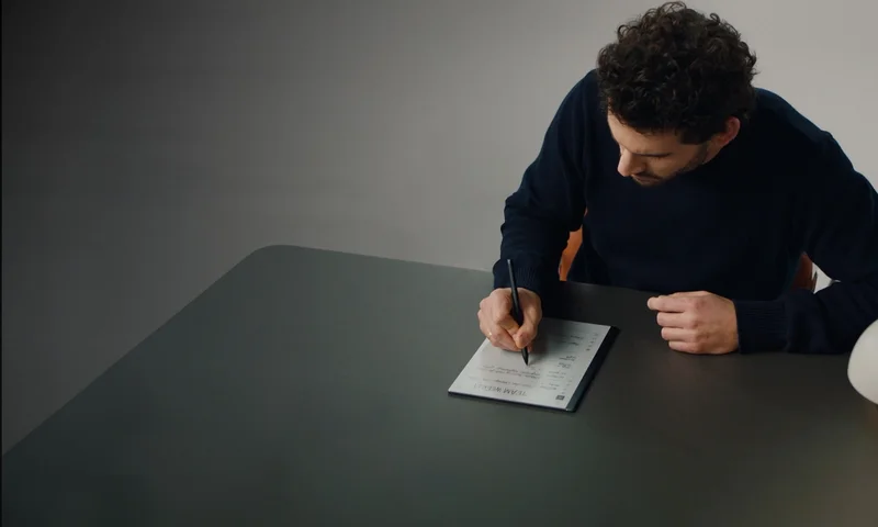 Man writing on reMarkable 2
