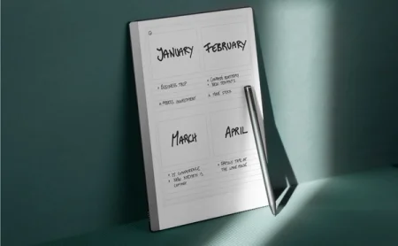 A reMarkable paper tablet displaying a planner with the Marker resting on top.