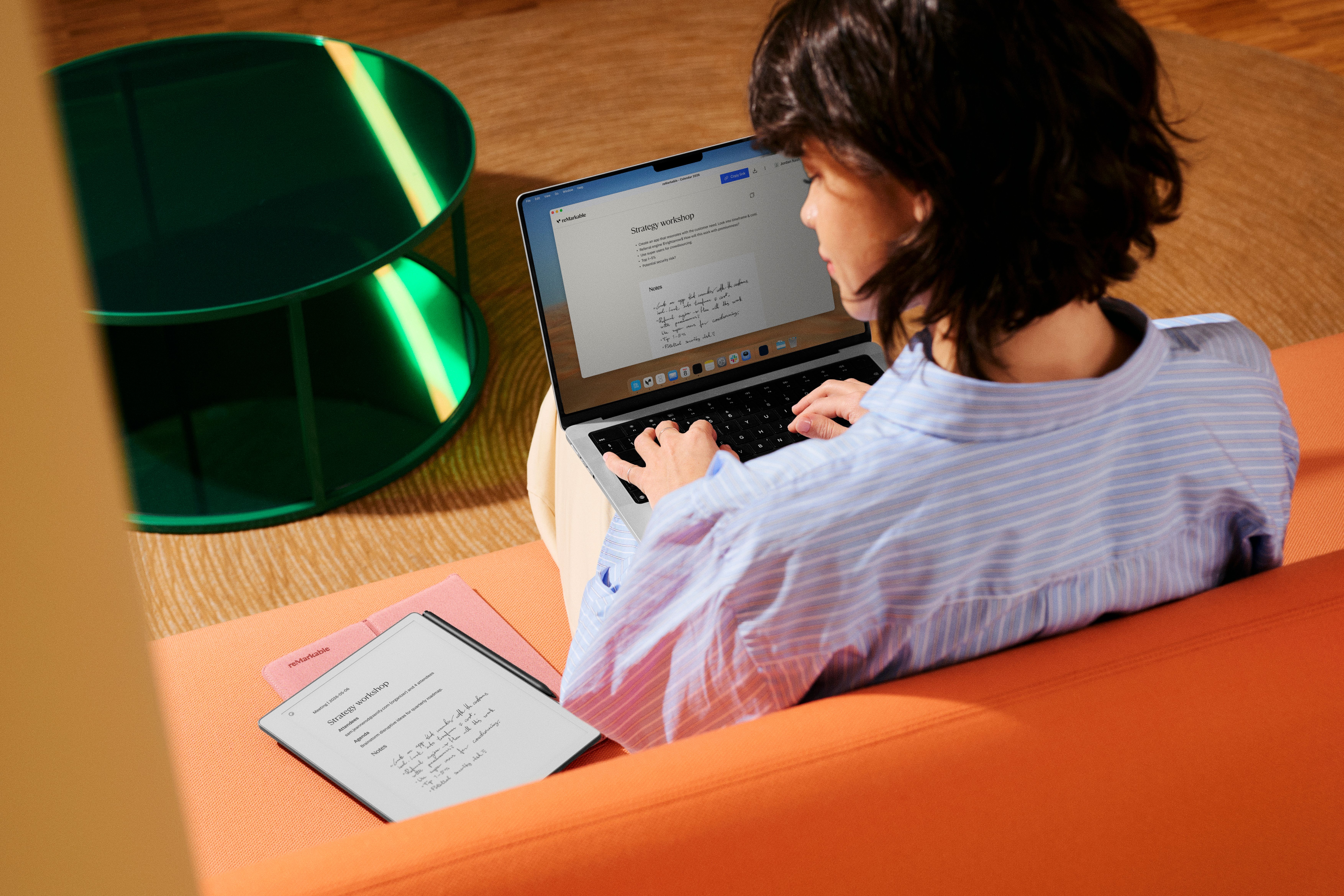 A woman finalizing meeting notes from her reMarkable Paper Pro after a workshop