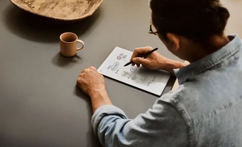 A man thinking while using the reMarkable