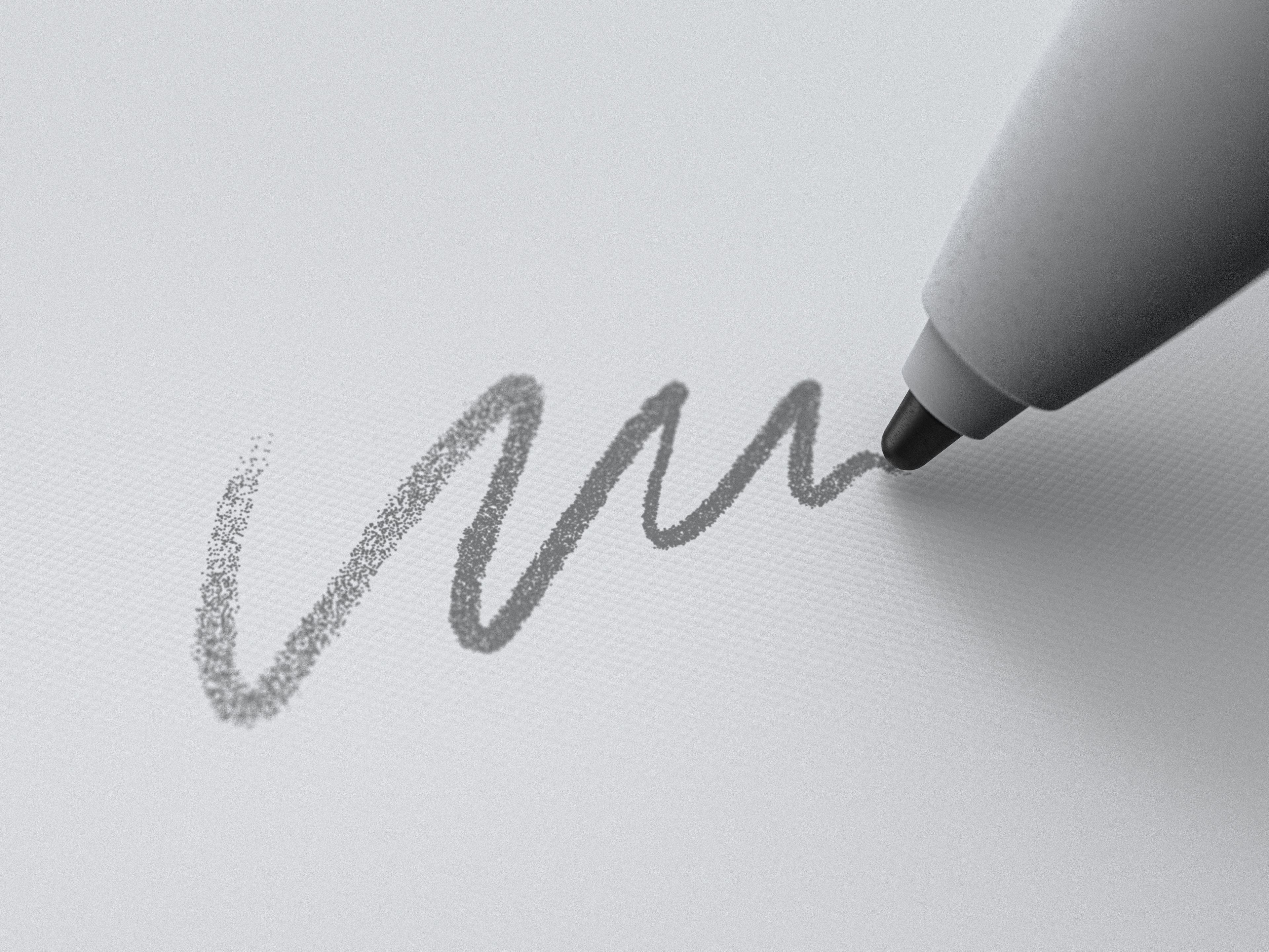 Marker drawing a line on reMarkable paper tablet.