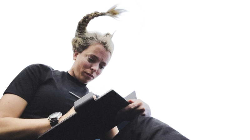 Jannicke Mikkelsen floating in microgravity writing on her reMarkable Paper Pro.