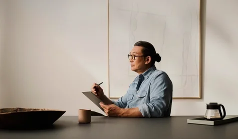 A man using a reMarkable Paper Pro and Marker Plus in a calm office environment