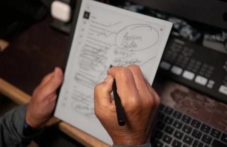 Guy writing on a reMarkable