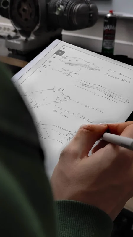 A reMarkable paper tablet displaying sketches with handwritten annotations.
