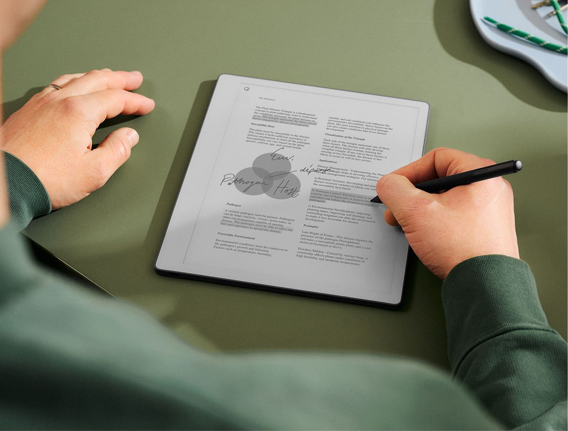 A man reviewing a document on his reMarkable paper tablet.tablet.
