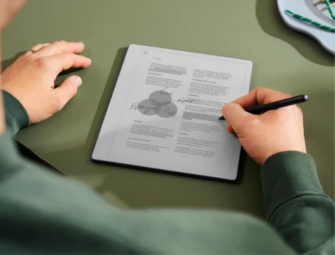 A man reviewing a document on his reMarkable paper tablet.tablet.