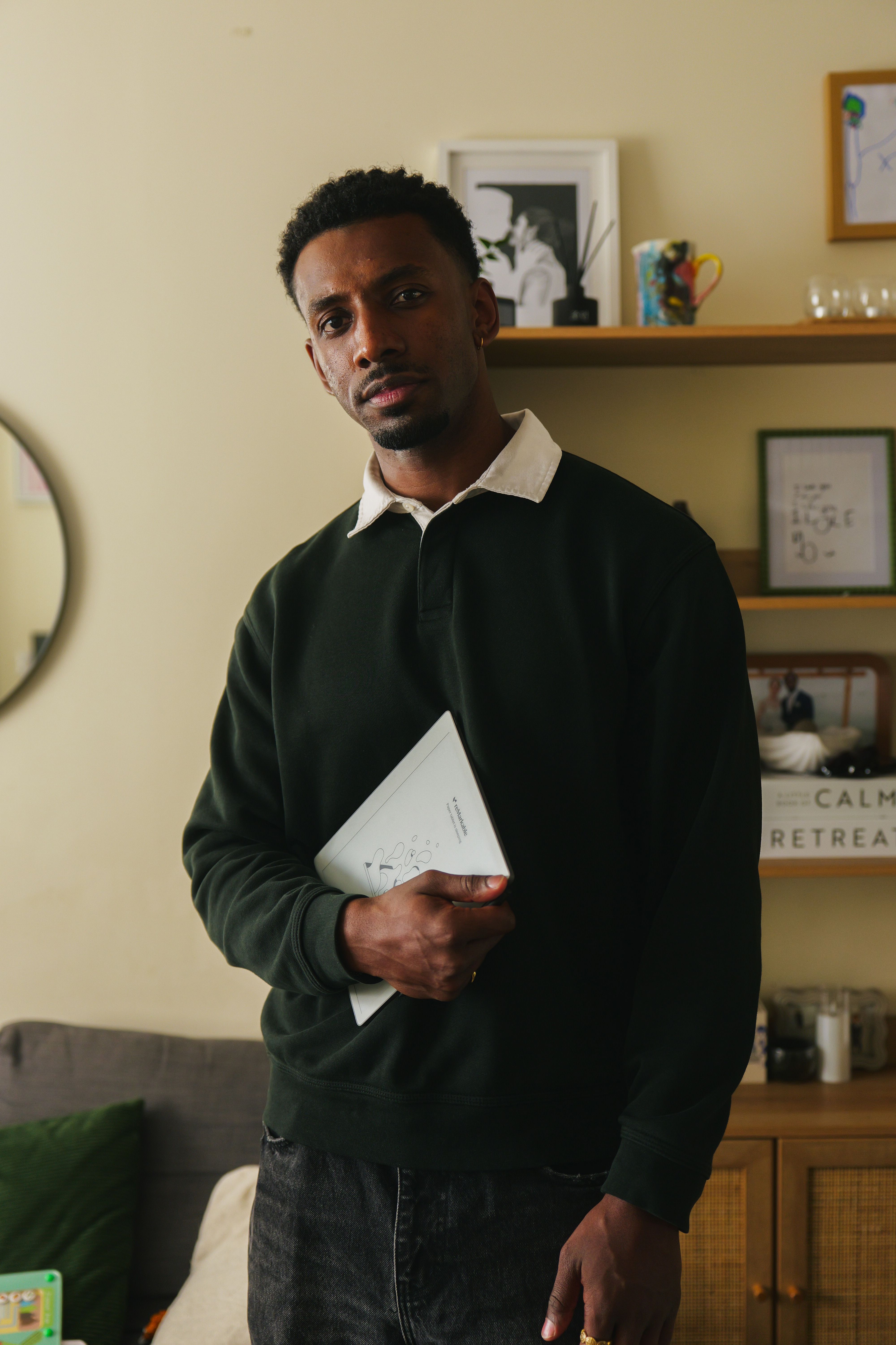 Jordan Jaiyeola holding his reMarkable Paper Pure tablet.