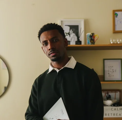 Jordan Jaiyeola holding his reMarkable Paper Pure tablet.