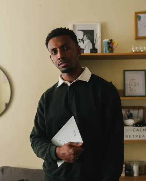 Jordan Jaiyeola holding his reMarkable Paper Pure tablet.