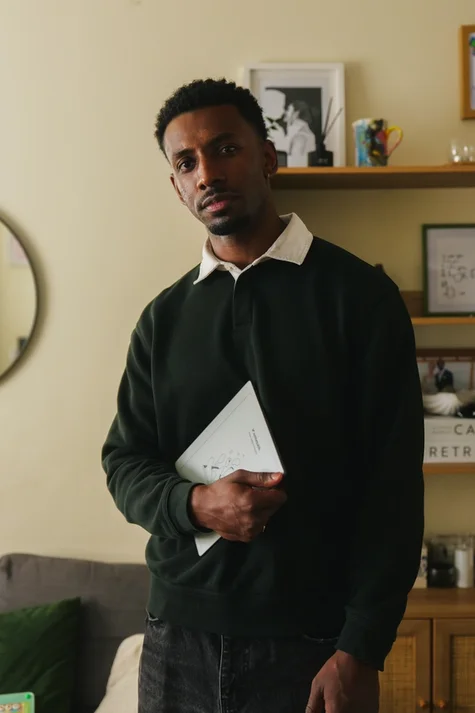 Jordan Jaiyeola holding his reMarkable Paper Pure tablet.