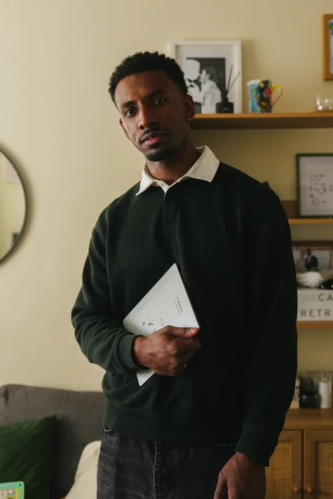 Jordan Jaiyeola holding his reMarkable Paper Pure tablet.