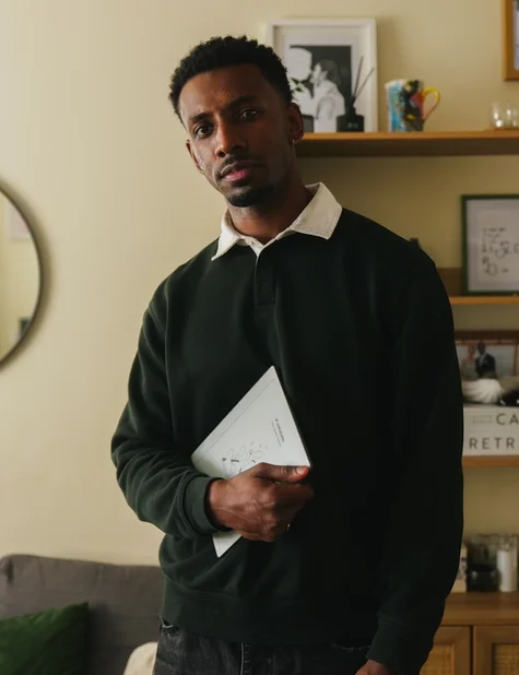 Jordan Jaiyeola holding his reMarkable Paper Pure tablet.