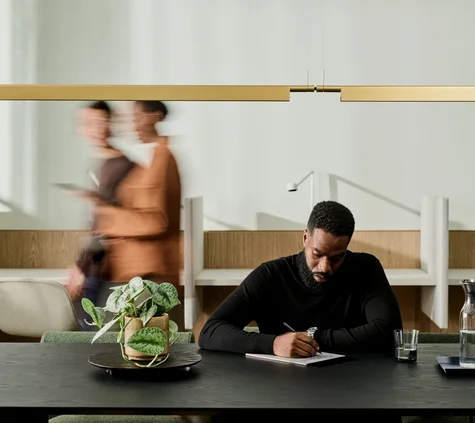 man working with remarkable paper pro in busy environment