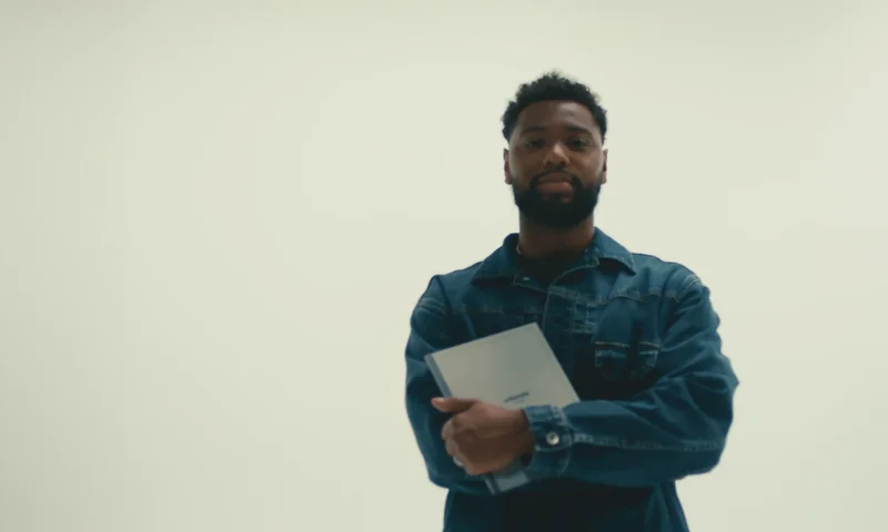 Man standing with reMarkable paper tablet