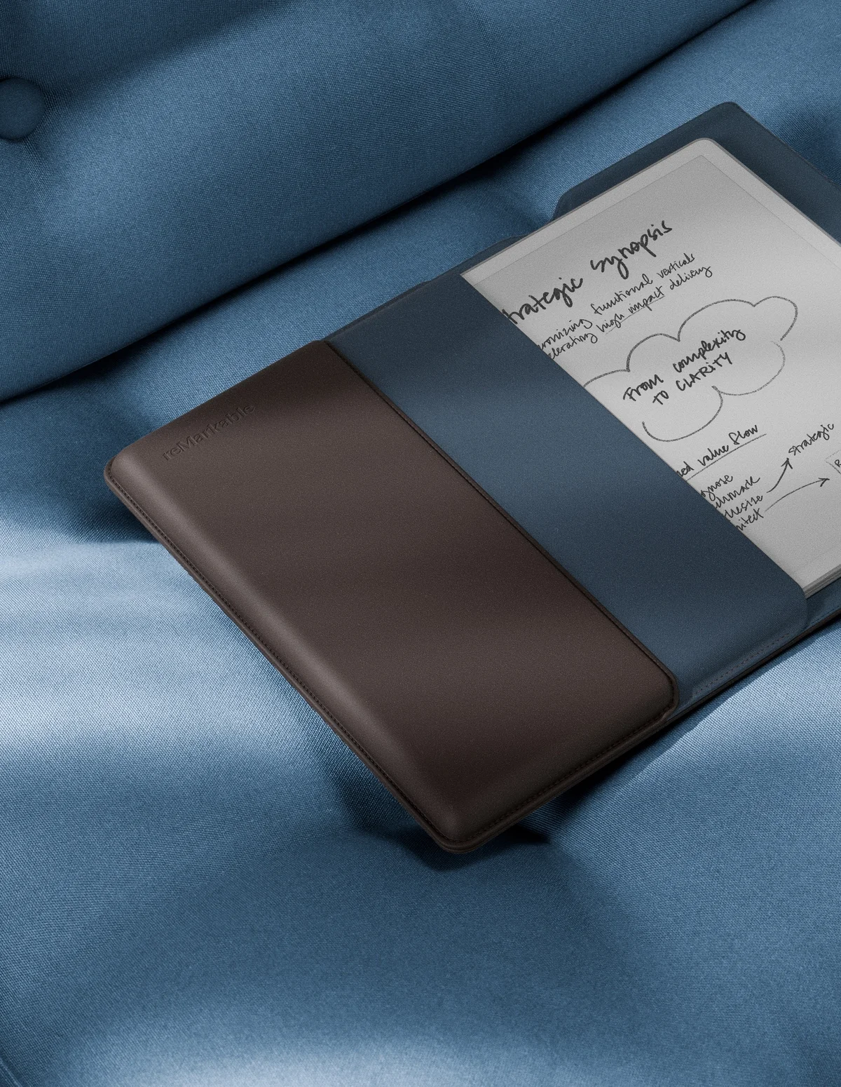 Image of the reMarkable Paper Pure with Leather Brown folio in a chair